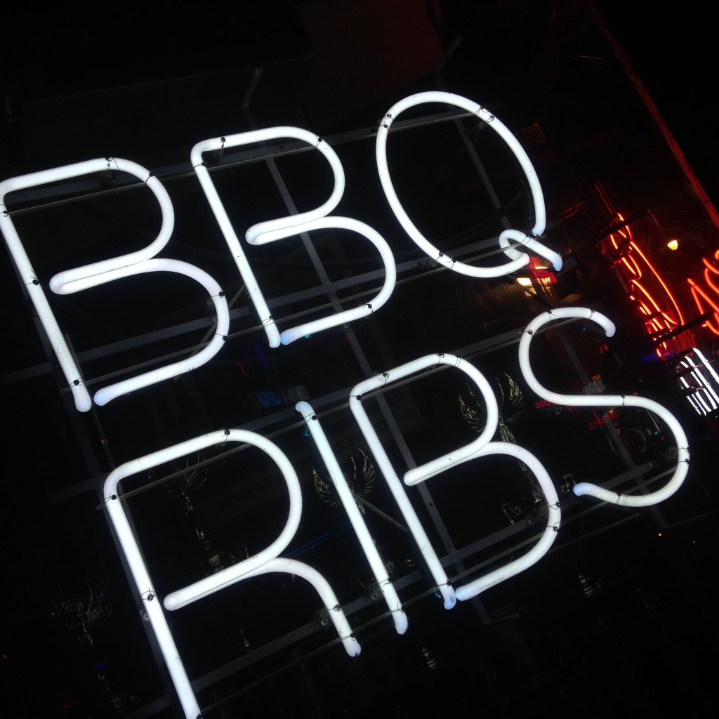 A neon sign advertising a Memphis BBQ ribs joint.  Photo Courtesy of Madison Moore. 