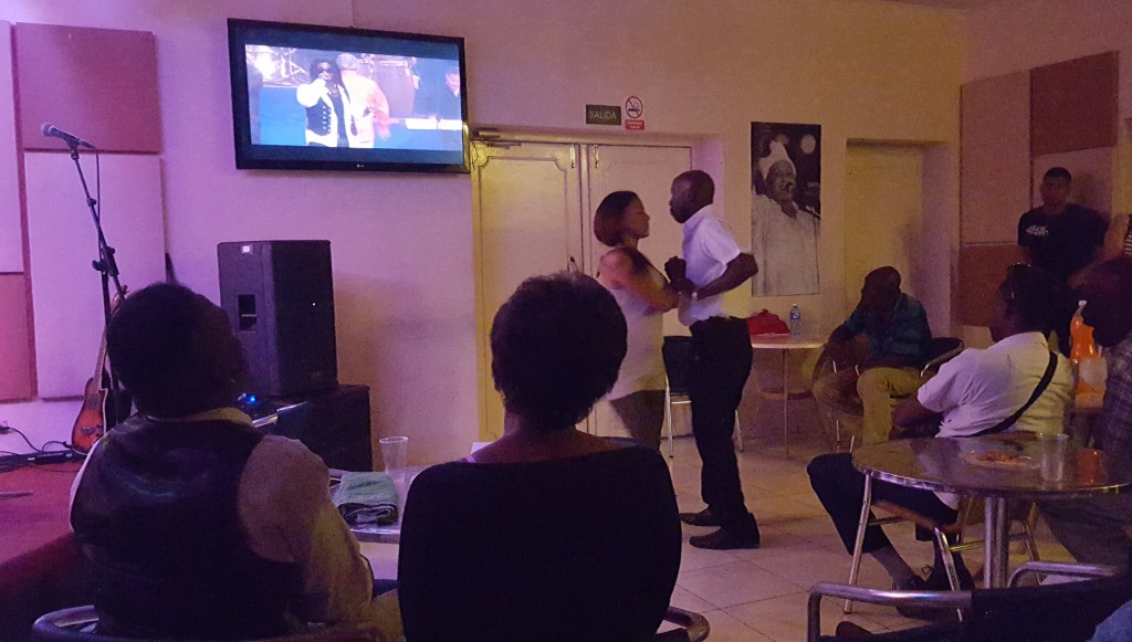 Waiting for the concert: looking at and dancing to the screen. Havana, Cuba