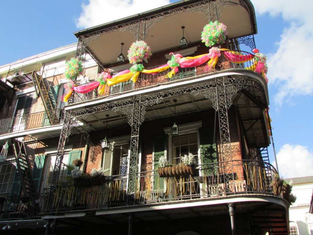 New Orleans wrought iron balconies and Mardi Gras paraphernalia - Photo courtesy of Elina Djebbari