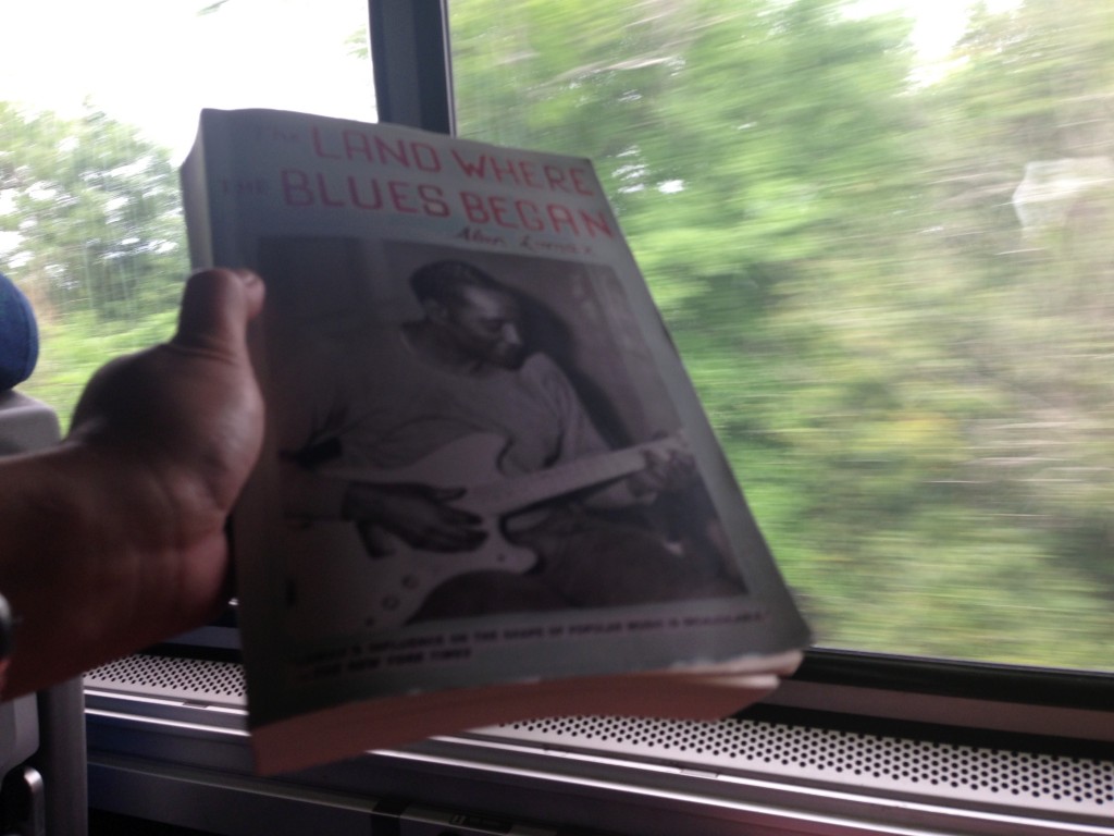 Reading Alan Lomax while crossing the Mississippi River. Photo courtesy of Ananya Kabir 