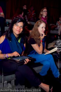 Ananya Kabir and Joanna Menet with traditional and new research tools at the Berlin Salsa Congress. photo courtesy Daniel Kyun.